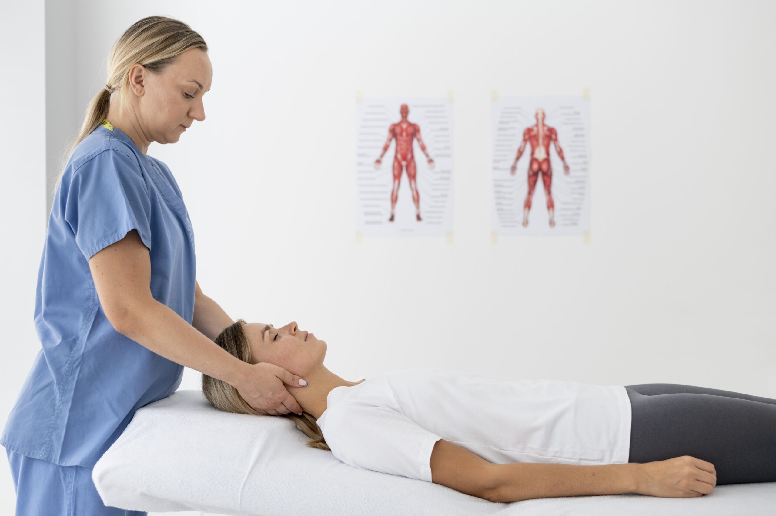 osteopathe helping young female patient